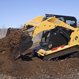 Yellow bulldozer with high performance paint moving dirt