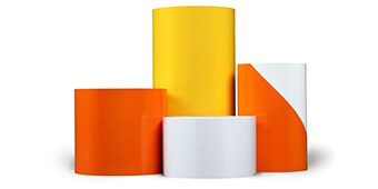 Orange, yellow and white rolls of 3M™ Advanced Flexible Engineer Grade Sheeting Series 7300.