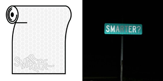 A street sign reading “SMARTER?” is illuminated at night; only some letters are bright, and the sign is hard to read.
