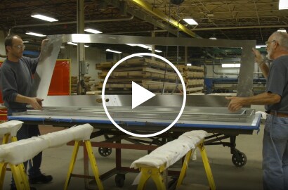Still shot from a video talking about Dawson Doors eliminating production steps by switching to a 3M structural adhesive