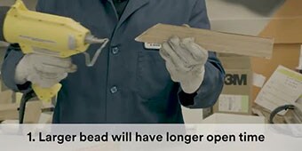 Video still showing application to wood with the caption “Larger bead will have longer open time”
