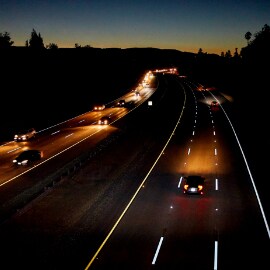 Image of 6 lanes of road at dusk with 3M™ Connected Roads All Weather Elements visible