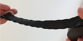 hands releasing tape on roll of Scotch® Vinyl Electrical Tape Super 33+™