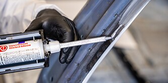 Technician completing structural bonding repair
