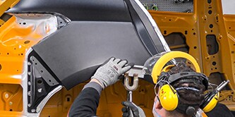Technician completing panel bonding process

