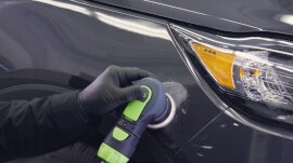 Sander being used on large surface of a car
