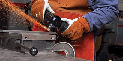 An angle grinder wheel being used and making sparks
