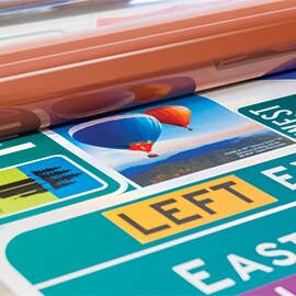 A custom road sign with multiple colors and graphics.