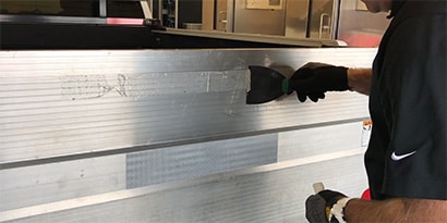 Removing reflective tape adhesive
