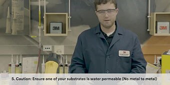 Video still of the engineer with the caption “Caution: Ensure one of your substrates is water permeable (no metal-to-metal)
