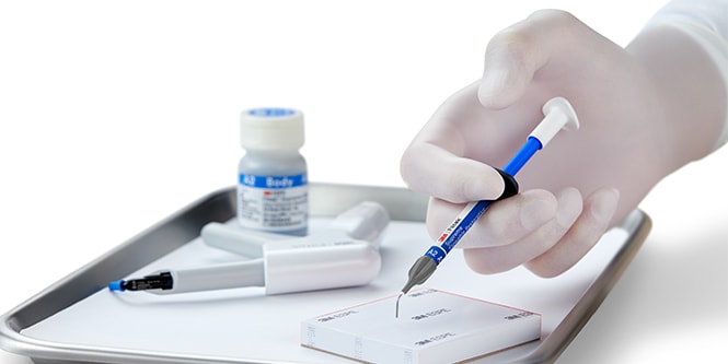 hand holding syringe
