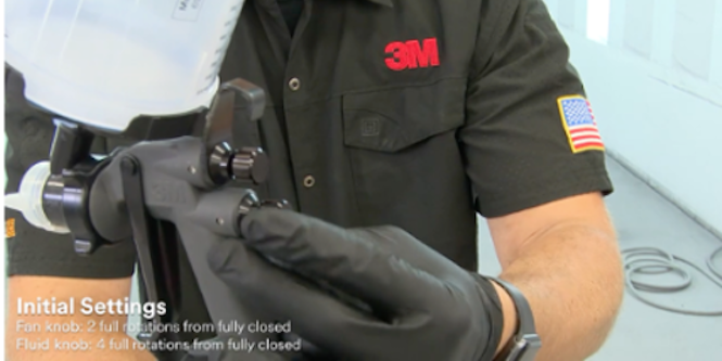 image of person holding the spray gun

